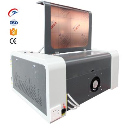 China Water Cooled 6040 Laser Engraving Mini Laser Engraving Machine CO2 Laser Engraving Machine for sale