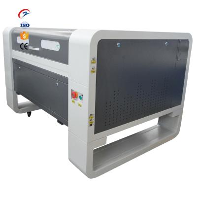 China Water Cooled Laser Clothes 6040 Fabric Laser Engraving Machine CNC Laser Engraver for sale