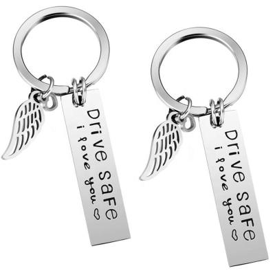 China Durable Wholesale Custom Silver Words Key Chain Stainless Steel Custom Etched Logo Wing Charm Customized Key Chain For Gift for sale