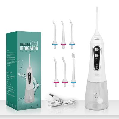 China Household Portable Oral Irrigator Spray Pick With Spare Use Floss Irrigator Upside Down For Teeth Cleaning for sale