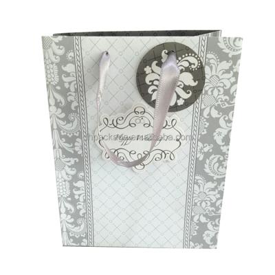 China Recycled Materials Wholesale Custom Printed Decorative Wedding Paper Bags for sale