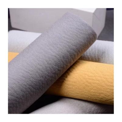 China Breathable Polyester Leather Home Textile Upholstery Faux Embossing And Bonding Fabric For Sofa for sale