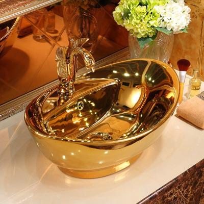 China Hot Sale Modern European Style Hotel Home Luxury Gold Plated Sink Hand Wash Countertop Basin Ceramic Gold Bathroom Sink for sale