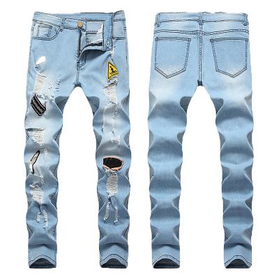 China Breathable Men Fashion Hole Streetwear Hip Hop Slim Straight Jeans Pants Male Ripped Stretch Solid Casual Denim Pants for sale