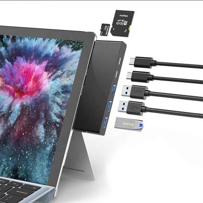 China Portable Docking Station USB C Hub Multiport Adapter 7 in 1 with USB 3.0*3+USB-C*2+TF+SD Port for sale