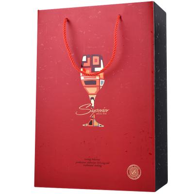 China Recyclable Luxury Wine Paper Bag Bottle Grocery Shopping Paper Bag With Handle for sale