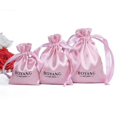 China Recyclable Small Drawstring Pocket Pink Promotional Luxury Silk Hair Extension Satin Packaging Bag for sale