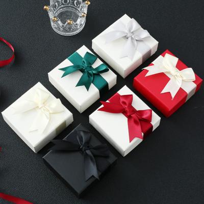 China Cardboard Bow Jewelry Packaging Box Ring Box Silk Paper Lid And Ring Base Paper Box for sale