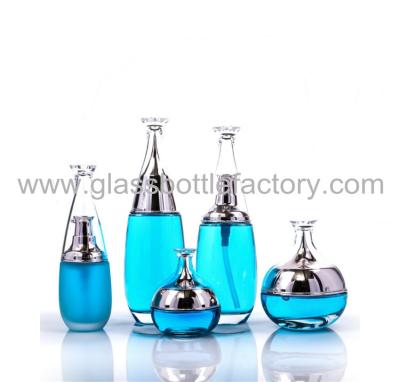 China New Design Blue Glass Lotion Bottle And Glass Cream Jar With Silver Cap and Pump for sale