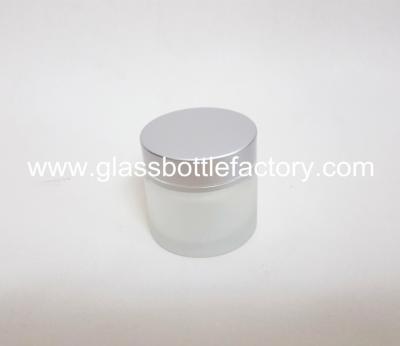 China 60g Cylinder Frost Glass Cosmetic Jar With Silver Lid for sale