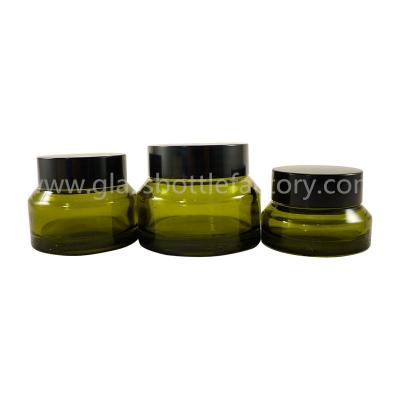 China 15g,30g,50g Olive Green Sloping Shoulder Glass Cosmetic Jar With Black Lid for sale