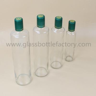 China Clear Dorica Olive Oil Glass Bottles With Green Caps for sale