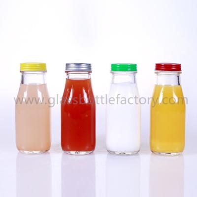 China 300ml Starbucks Style Glass Milk/Juice Bottles With Caps for sale