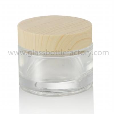 China 50g Round Glass Cosmetic Jar With Wood Lid for sale