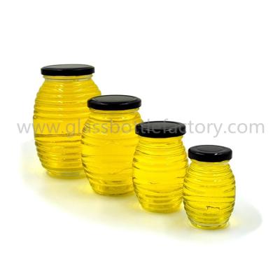 China 100g,250g,500g,1000g Clear Glass Honey Jars With Lids for sale