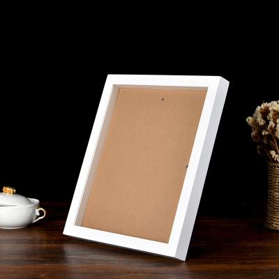 China Simplicity Vintage White Solid Wood Picture Frame Set 2cm Hollow Wall Hanging Hanging Home Picture Frames for sale