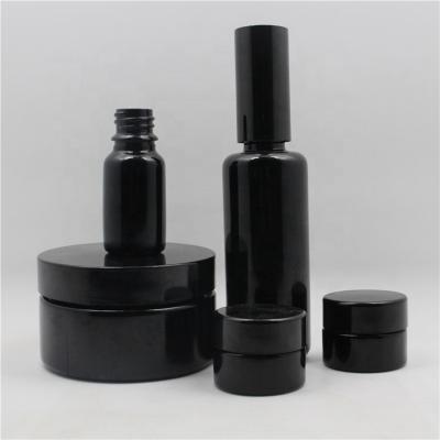 China 100ML 200ML Personal Care Products Lotion Cream Cosmetic Bottles Black UV Glass Bottles Glass Jar for sale