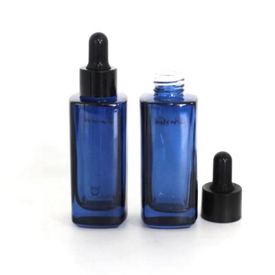 China NEW Design Personal Care 50ml Dropper Blue Square Glass Serum Bottle Cosmetic Bottle For Skin Care Packaging for sale