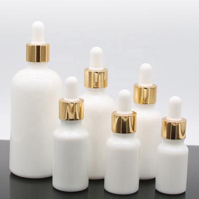 China Personal Care 15ml 30ml 50ml Glass Dropper Bottles White Porcelain Essential Oil Cosmetic Containers With Gold Cap for sale