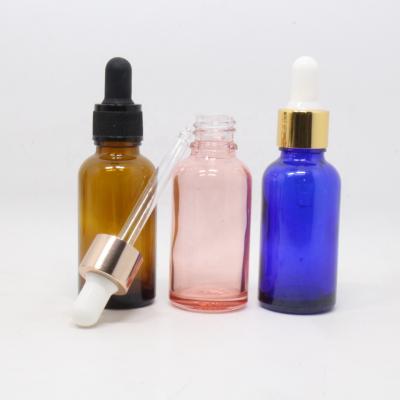 China Personal care frosted clear blue pink glass dropper bottle with gold collar 30ml 50ml cbd essential oil bottle for sale