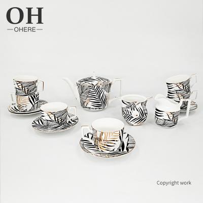 China 2022 New Sustainable High End Luxury Charger Dish Coffee Cups And Saucers Sets Black And Gold Leaves To Wedding Dinnerware Sets for sale