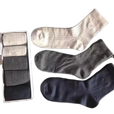 China Anti-skid socks 2021 all cotton business elite embroidery OEM China factory solid color four seasons men's office tube socks for sale