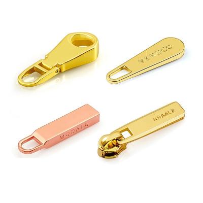 China Wholesale New Design Nickel Free Custom Embossed 3D Logo Zipper Pullers For Garment Metal Zipper Pull for sale