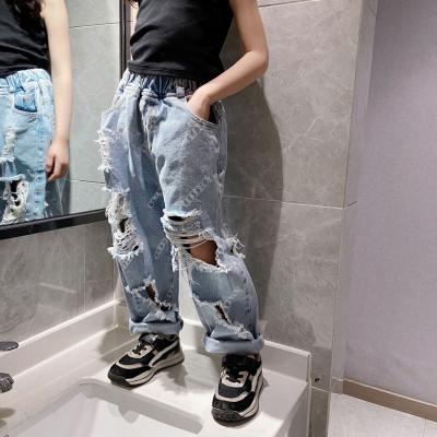 China Girls Big Hole QUICK DRY Denim Loose Pants Fashion Tassels Beggar Pants Wholesale Kids Soft Jeans Trousers for sale