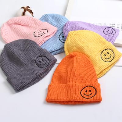 China JOINT cute warmer knitted girls hat boutique smile bennie hat kids winter hats for sale