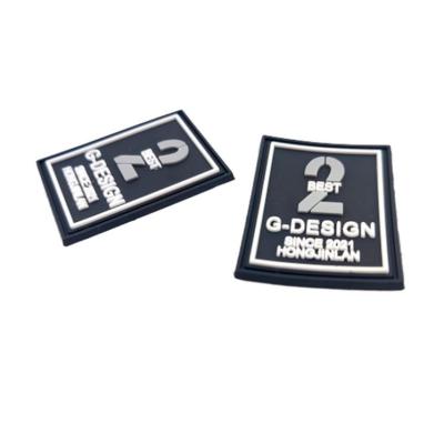 China Custom Eco-friendly Embossed Silicon Patch 3D Soft Rubber PVC Patch Label for Clothing for sale