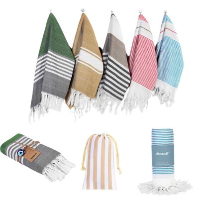 China QUICK DRY Custom Sand Microfiber Bath Stripe Jacquard Free Beach Towel With Tassel Polyester Turkish Beach Towel for sale