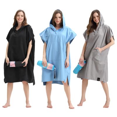 China Custom Compressed Microfiber Beach Towel Surf Poncho Women Man Ponchos Towels With Mesh Bag for sale