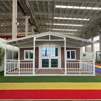 China Double Wing Luxury Expandable Container House With Extra Roof & Veranda for sale