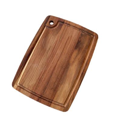 China Modern Simple Natural Organic Thick Acacia Rectangle Household Sustainable Kitchen Large Hanging Wooden Cutting Board With Drip Juice Grooves for sale