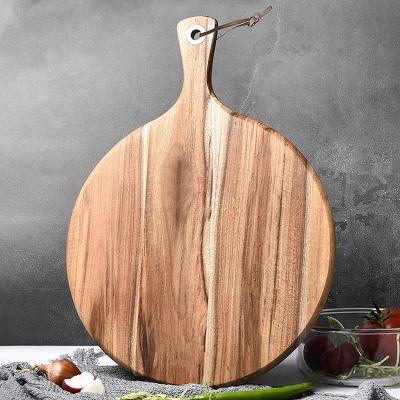 China Large Sustainable Natural Shape Medium Aged Black Acacia Mango Wood Circular Circle Cutting Cheese Board And Charcuterie Board Wood for sale