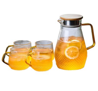 China Sustainable Supply Professional Heat Resistant Glass Pitcher Wooden Low Glass Water Jug With Plastic Lid for sale