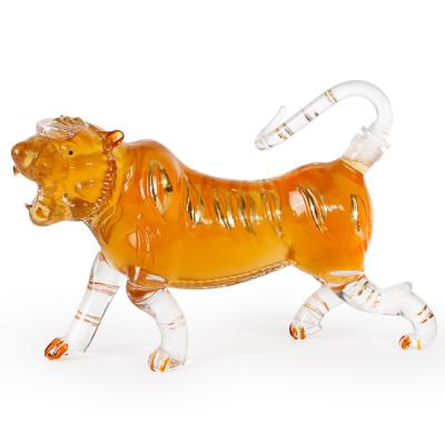 China 2021 Hot Wholesale Chinese Zodiac Beverage High Borosilicate Glass Wine Bottle Custom Made Tiger Shaped Art Glass Wine Bottle for sale