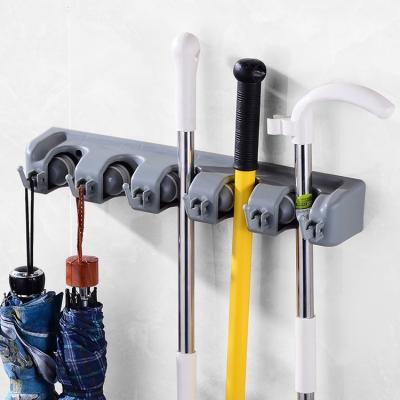 China Behind Doors/On Walls Wall Mounted Broom Holder Broom Organizer Rack Hook Adhes Broom Hangers Storage Rack Broom Holder Adhesive Hangs Kitchen Wall Hooks for sale