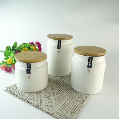 China Freshness Retention Ceramic Porcelain White Color Glazed Candy Canister Jar With Bamboo Lids Sets for sale