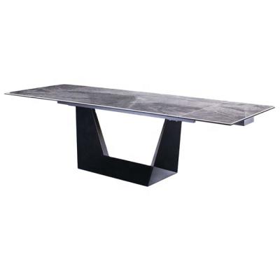 China Gray Ceramic Modern Extendable and Black Metal Dining Table for sale