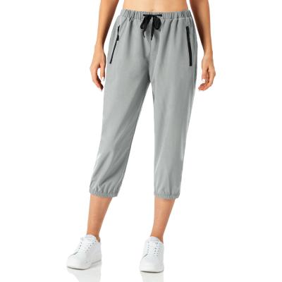 China Custom Anti-Wrinkle Joggers Pants Womens Sweatpants Cropped Running Pants Quick Dry With Zipper Pocket for sale