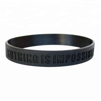 China Fancy silicone and iron factory logo OEM Debossed silicone wrist band for party for sale