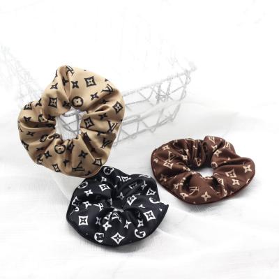 China Reusable Hair Tie Fashion Hair Scrunchies With Stretch Elastic Band Braid Headband Letter Printed Geometric Pattern Brand Hair Ties for sale