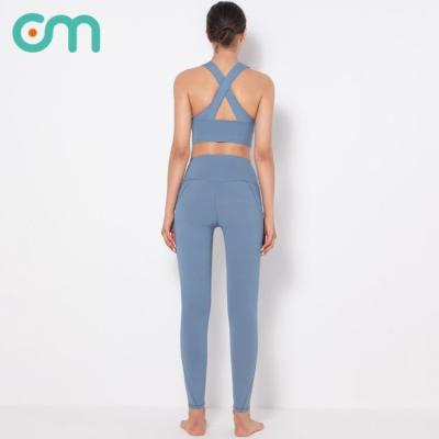 China Women's Breathable High Waist Hip Lift Yoga Vest Solid Color Pocket Naked Fitness Fitness Pants Brab Tracksuit for sale