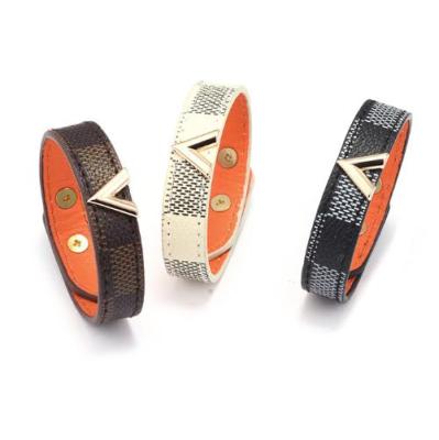 China Fashion Casual/Sporty Women's Bracelets Brown and Gold Leather V-shaped Metal Bracelet Black Patterned Decorative Leather Bracelet for sale