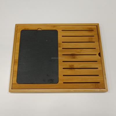 China Sustainable Bamboo Wood Slotted Break Bread Board With Slate for sale