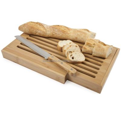 China Sustainable bamboo bread cutting board with crumb catcher and knife for sale