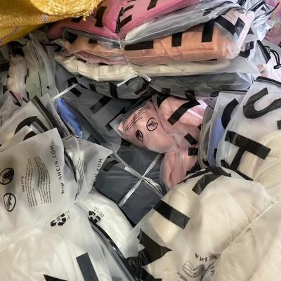 China Second Hand Women's Supplier Bulks Brand New Stock Tops Mix Assorted Dress Bulk Bales Used Clothes for sale