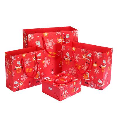 China Recycled Materials Wholesale Christmas Tablecloth Paper Bag Christmas Gonks Christmas Doll Bag High Quality for sale