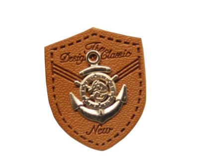 China custom leather labels for hats garment leather tags wholesale with metal logo for sale